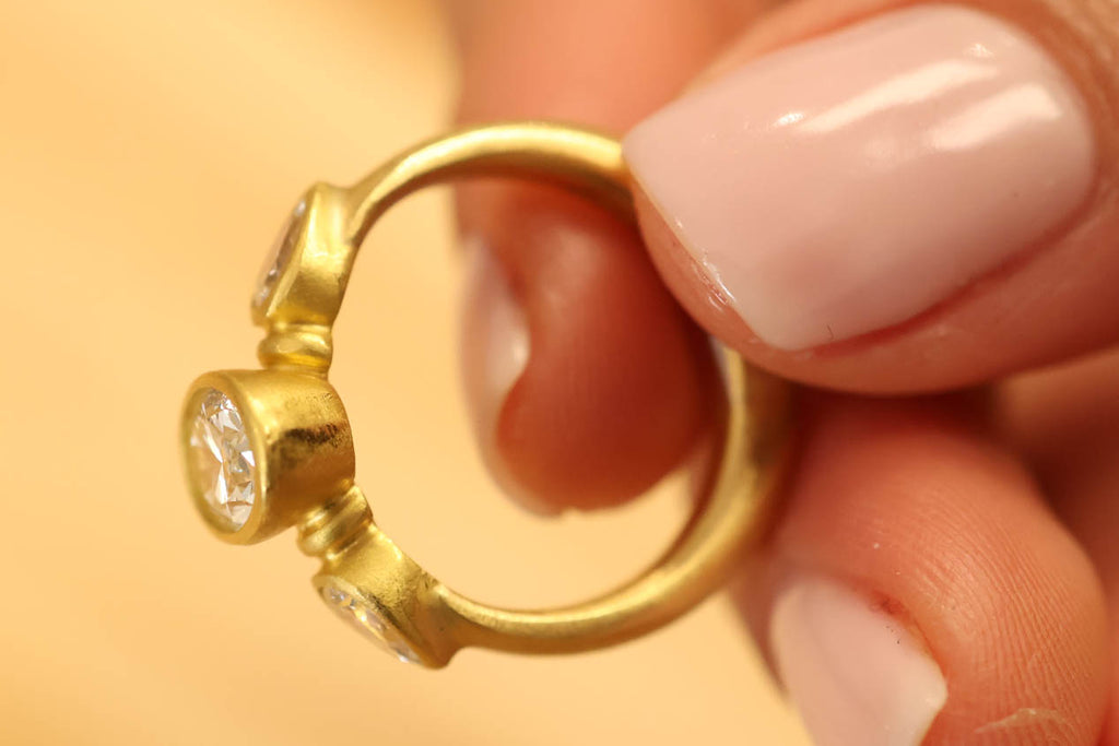 22K & 20K Brilliant Oval Diamond Ring with Diamond Pear Shape Side Stones