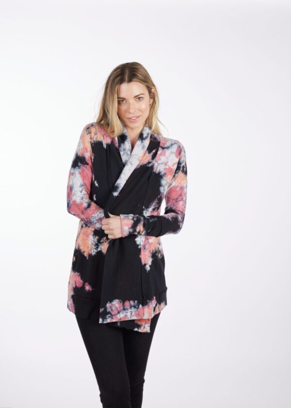 A Woman in a Full Black Coat With Floral Print