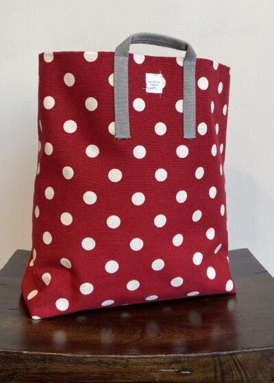 A Red Color Bag With White Polka Dots