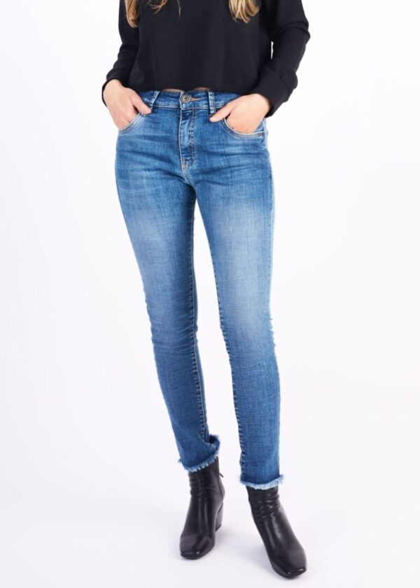 A Woman in a Skinny Faded Jeans With Rigged Hem