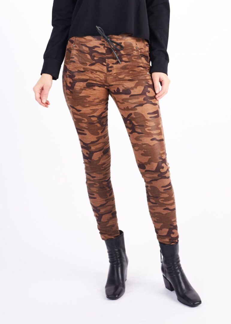 A Woman in a Brown Color Camo Theme Pants