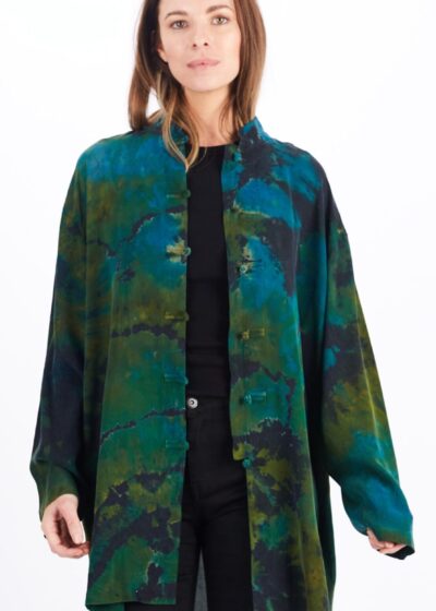 A Woman in a Green Color Pattern Overcoat