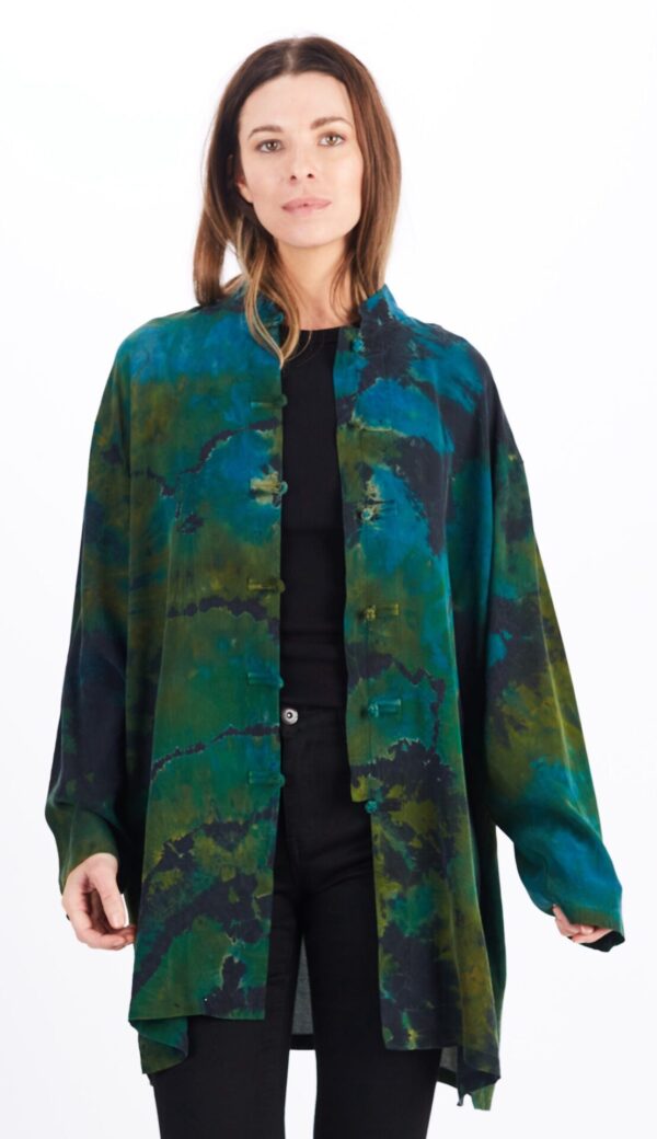 A Woman in a Green Color Pattern Overcoat