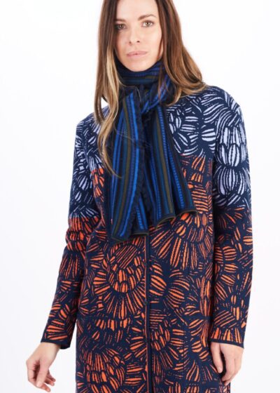 A Woman in a Navy Blue Coat With Orange and Blue Design