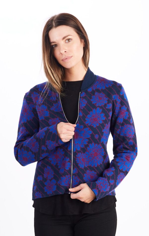 A Woman in a Blue Flower Pattern Front Zipper Sweater