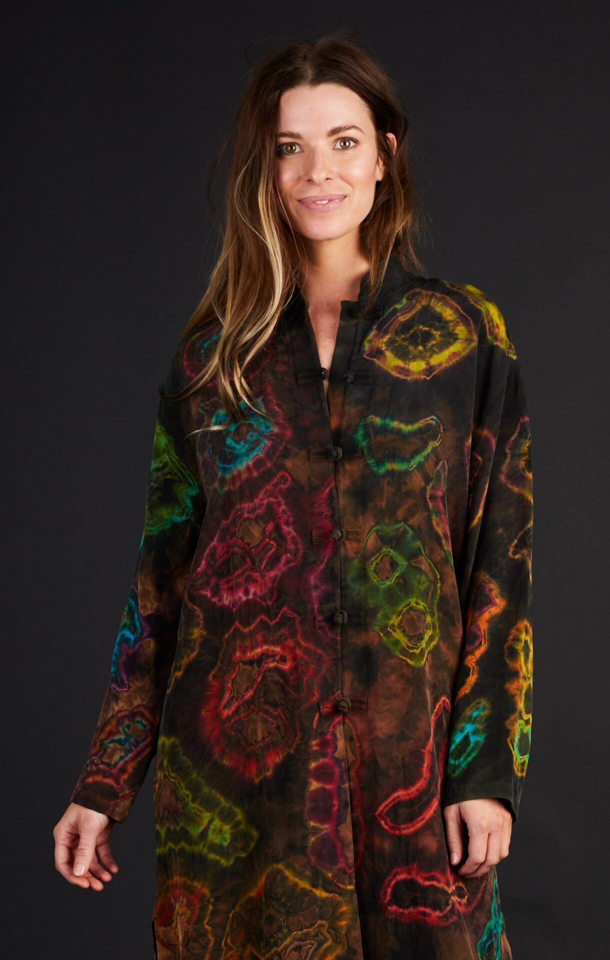 A Woman in a Black Color Top With Multi Color Designs