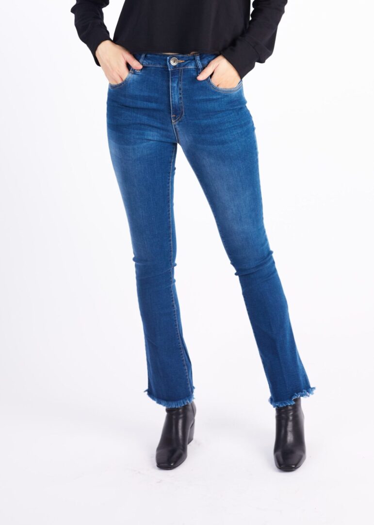 A Woman in a Long Blue Color Jeans With Wide Ends