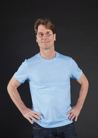 A Man Wearing a Blue Color Half Sleeves Top