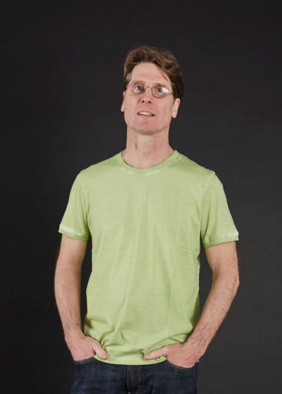 A Man in a Green Color Half Sleeve Shirt