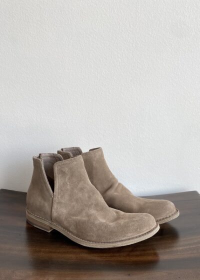 A Pair of Suede Boots With a Side Slit