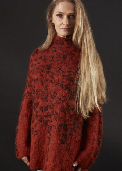 A Woman With Long Blond Hair and a Red Sweater