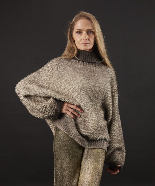 A gray color sweater with a black background