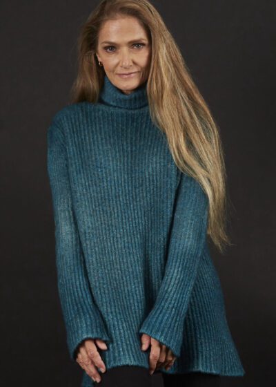 A Woman in a Green Blue Color Sweater