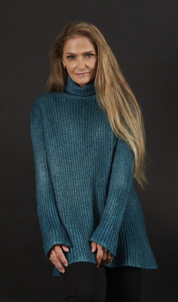 A Woman in a Green Blue Color Sweater