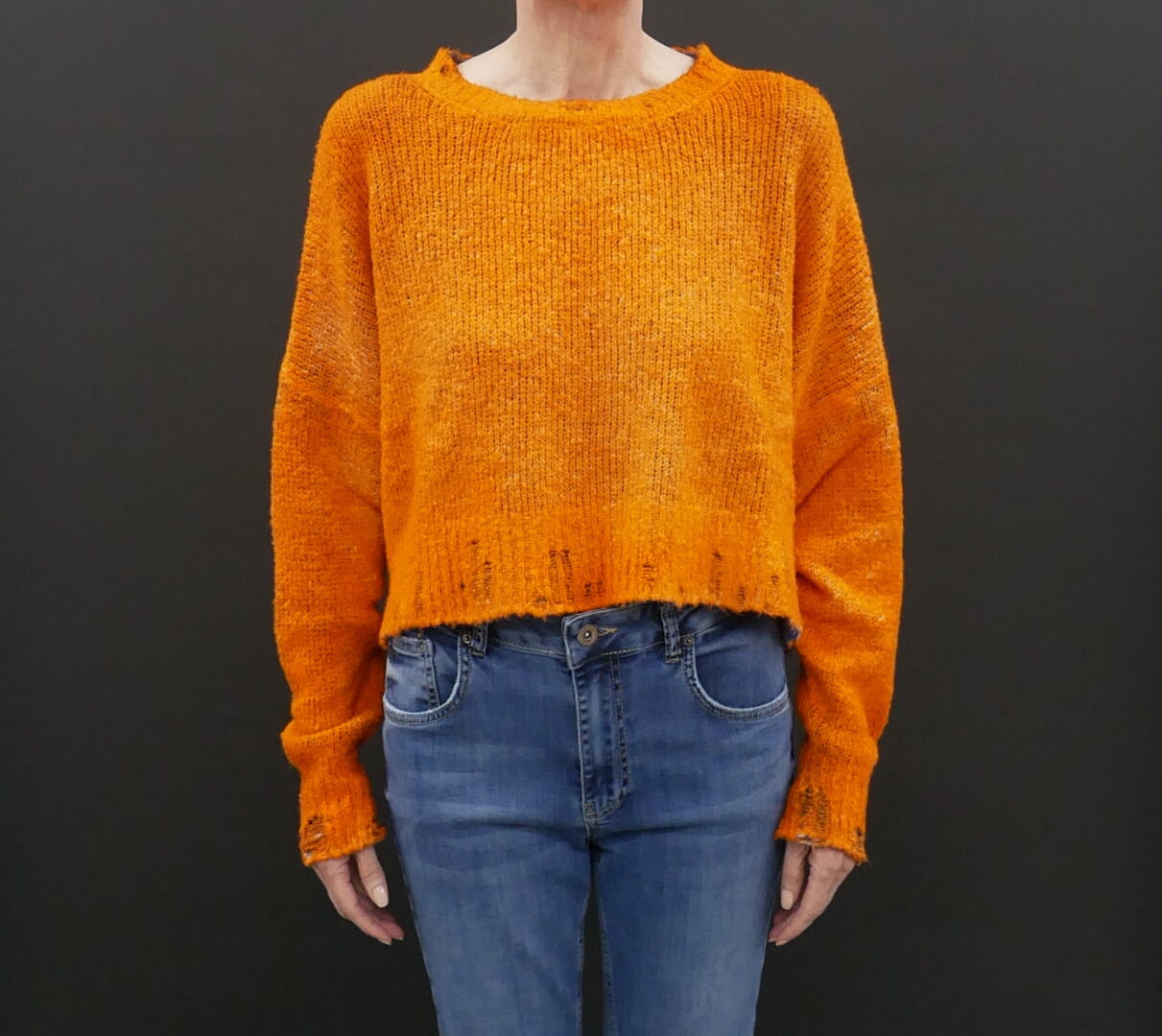 A Woman in an Orange Color Crop Sweater