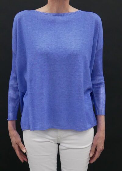 A Woman in a Loose and Rigged Blue Color Sweater