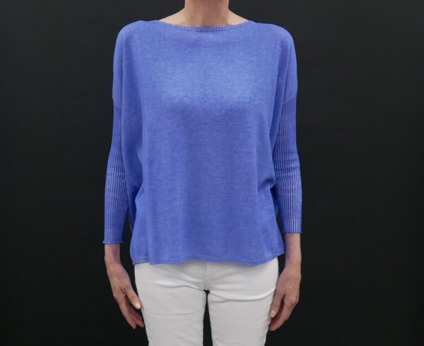 A Woman in a Loose and Rigged Blue Color Sweater