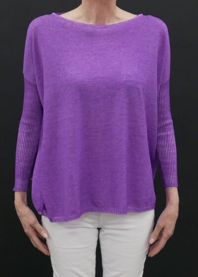 A Violet Color Loose Shirt on a Woman With White Pants