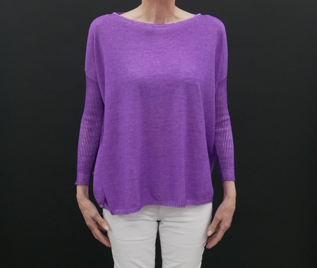 A Violet Color Loose Shirt on a Woman With White Pants