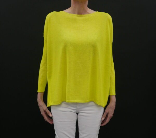 A Loose Yellow Color Sweater With Full Sleeves