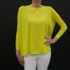 A yellow color top with a black background from front