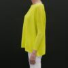 A yellow color top with a black background by side