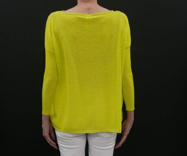 A yellow color top with a black background from back