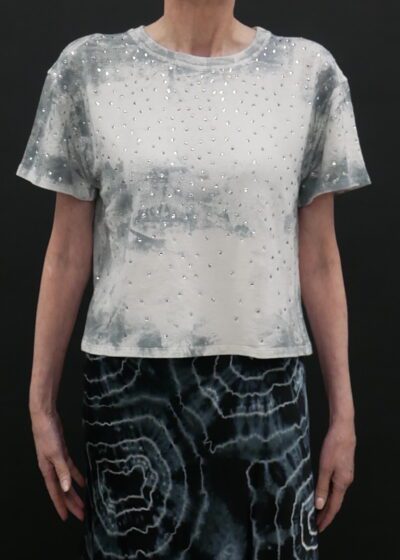 A printed white top by black background