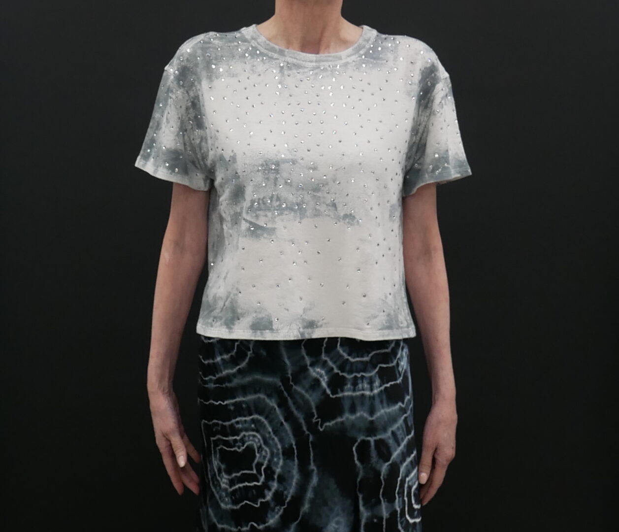 A printed white top by black background