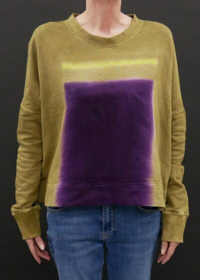 A Mustard Color Shirt With a Purple Strain