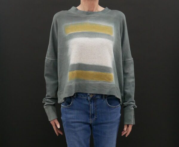 A Grey Color Sweater With White and Yellow Stripes