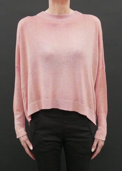 A Woman in a Loose Pink Color Sweater