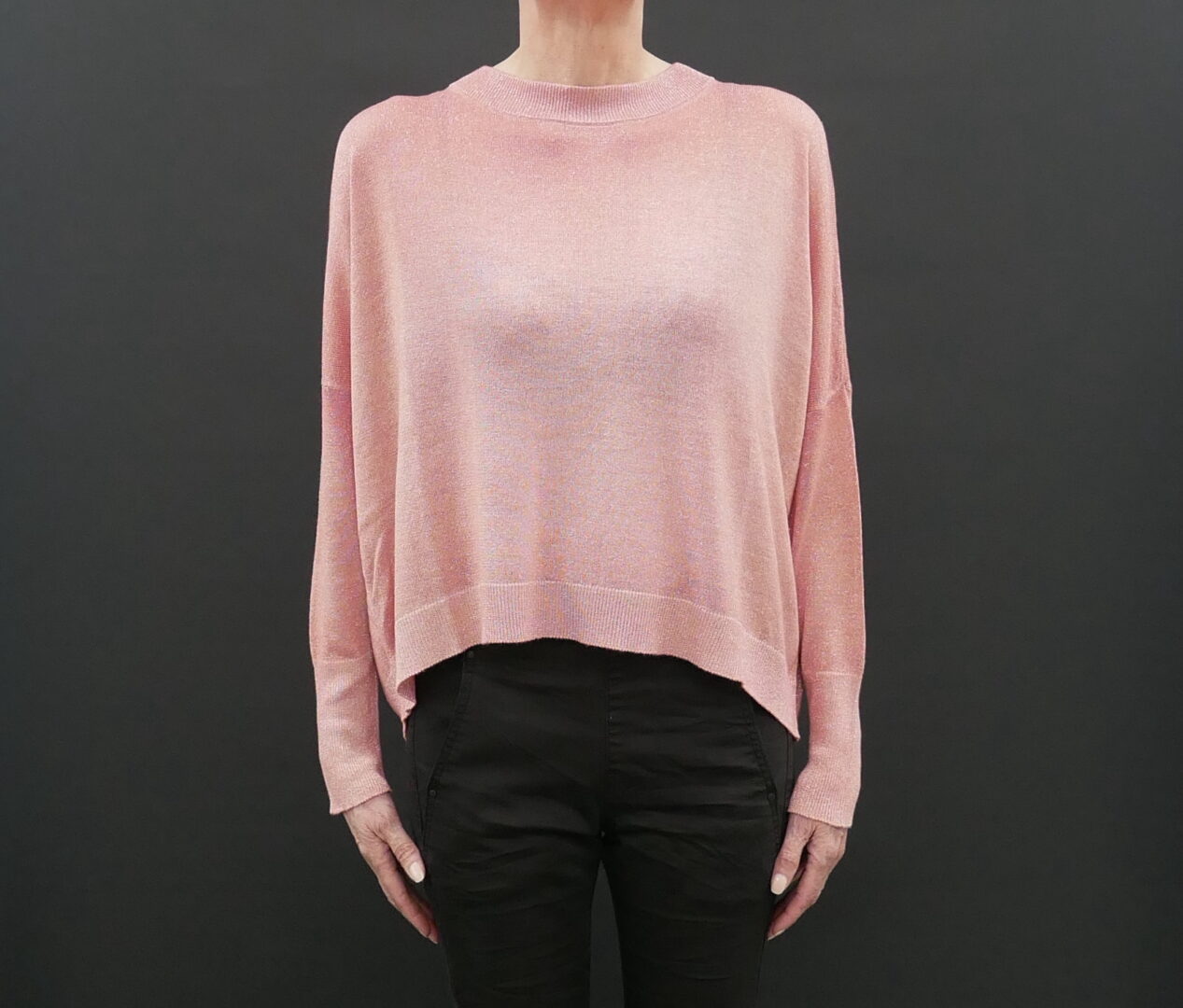 A Woman in a Loose Pink Color Sweater