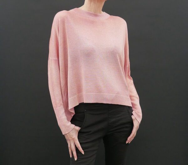 The Side Profile of a Woman in a Pink Color Sweater