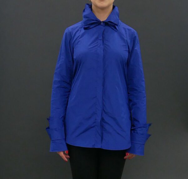 A Woman in a Blue Color Coat With a Zipper