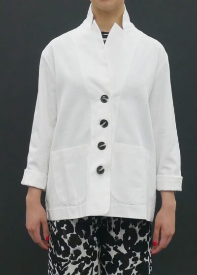 A Person in a White Color Coat With Black Buttons