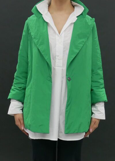 A Woman in a Green Color Coat With a Button